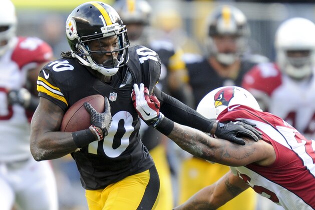 Pittsburgh Steelers wide receiver Martavis Bryant (10) tries to get away from Arizona Cardinals free safety Rashad Johnson (26) after making a catch in the second half of an NFL football game  Sunday, Oct. 18, 2015 in Pittsburgh. The Steelers won 25-13. (AP Photo/Don Wright)