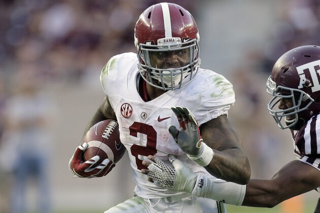 Alabama running back Derrick Henry (2) is chased by Texas A&M 's Myles Garrett, right, during the second half of an NCAA college football game, Saturday, Oct. 17, 2015, in College Station, Texas. Alabama won 41-23. (AP Photo/Eric Gay)