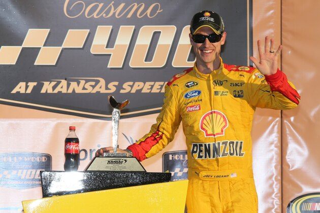 KANSAS CITY, KS - OCTOBER 18:  Joey Logano, driver of the #22 Shell Pennzoil Ford, poses in Victory Lane after winning the NASCAR Sprint Cup Series Hollywood Casino 400 at Kansas Speedway on October 18, 2015 in Kansas City, Kansas.  (Photo by Jerry Markland/Getty Images)