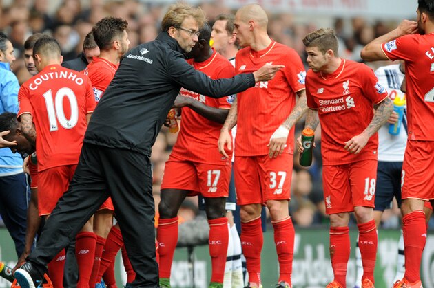 Liverpool manager Juergen Klopp talks to his players during a stoppage in play in the English Premier League soccer match between Tottenham Hotspur and Liverpool at the White Hart Lane, London, England, Saturday, Oct. 17, 2015. (AP Photo/Rui Vieira)
