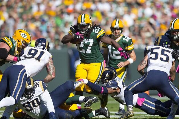 Oct 11, 2015; Green Bay, WI, USA; Green Bay Packers running back Eddie Lacy (27) rushes with the football during the first quarter against the St. Louis Rams at Lambeau Field. Mandatory Credit: Jeff Hanisch-USA TODAY Sports