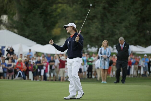 Emiliano Grillo, of Argentina, reacts on the 18th green of the Silverado Resort North Course after winning the Frys.com golf tournament Sunday, Oct. 18, 2015, in Napa, Calif. Grillo won the tournament on the second playoff hole. (AP Photo/Eric Risberg)