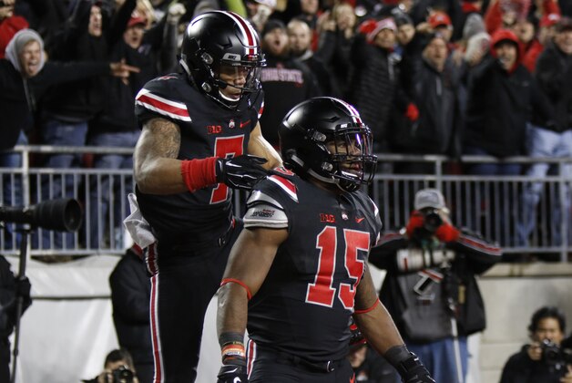 Ohio State  H-back Jalin Marshall (7) celebrates with running back Ezekiel Elliott (15) after Elliott's touchdown against Penn State during an NCAA college football game Saturday, Oct. 17, 2015, in Columbus, Ohio. Ohio State beat Penn State 38-10. (AP Photo/Paul Vernon)