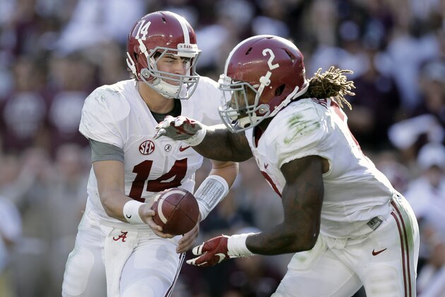 Alabama quarterback Jake Coker (14) hands the ball off to running back Derrick Henry (2) during the first half of an NCAA college football game, Saturday, Oct. 17, 2015, in College Station, Texas. (AP Photo/Eric Gay)