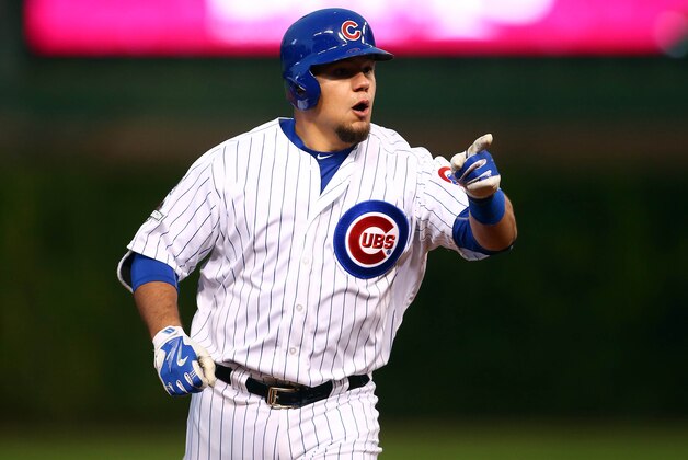 October 13, 2015; Chicago, IL, USA; Chicago Cubs left fielder Kyle Schwarber (12) reacts after he hits a solo home run in the seventh inning against St. Louis Cardinals in game four of the NLDS at Wrigley Field. Mandatory Credit: Jerry Lai-USA TODAY Sports