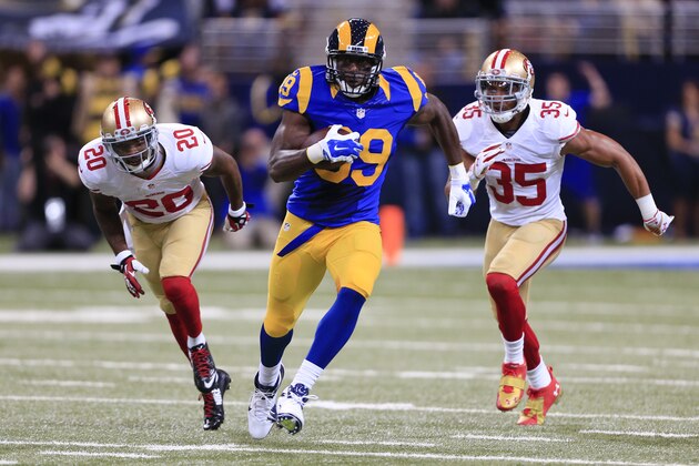 St. Louis Rams tight end Jared Cook (89) gets past San Francisco 49ers defenders Perrish Cox (20) and Eric Reid (35) in the first quarter of an NFL football game Monday, Oct. 13, 2014, in St Louis. (AP Photo/Billy Hurst)