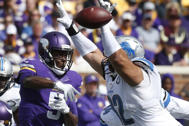 Detroit Lions defensive tackle Haloti Ngata (92) deflects a Minnesota Vikings quarterback Teddy Bridgewater (5) pass attempt in the first half of a NFL football game in Minneapolis, Sunday, Sept. 20, 2015. (AP Photo/Jim Mone)