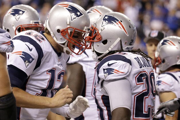 New England Patriots running back LeGarrette Blount (29) celebrates a touchdown with quarterback Tom Brady (12) in the second half of an NFL football game against the Indianapolis Colts in Indianapolis, Sunday, Oct. 18, 2015. (AP Photo/John Minchillo)