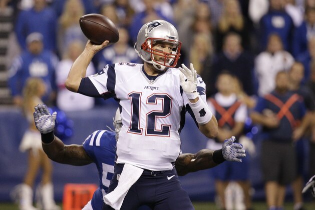 New England Patriots quarterback Tom Brady (12) throws against the Indianapolis Colts in the first half of an NFL football game in Indianapolis, Sunday, Oct. 18, 2015.  (AP Photo/John Minchillo)