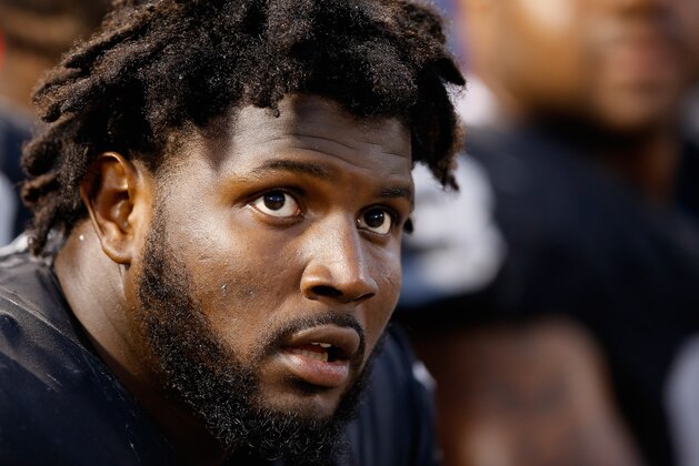OAKLAND, CA - AUGUST 30:  Mario Edwards Jr. #97 of the Oakland Raiders sits on the sidelines during their game against the Arizona Cardinals at O.co Coliseum on August 30, 2015 in Oakland, California.  (Photo by Ezra Shaw/Getty Images)