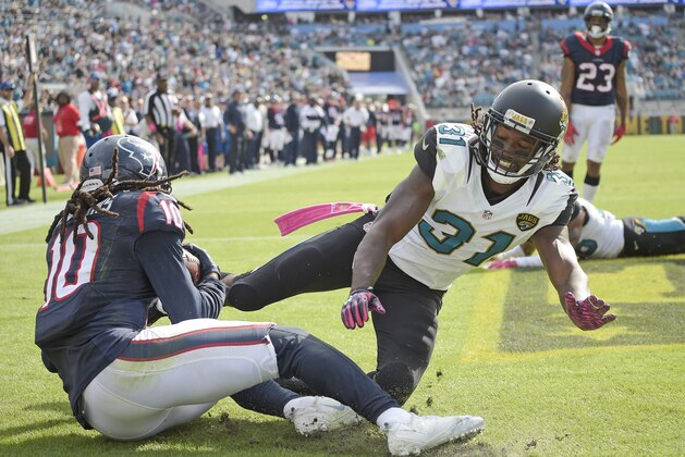 Houston Texans wide receiver DeAndre Hopkins (10) catches a pass in front of Jacksonville Jaguars cornerback Davon House (31) for a touchdown during the second half of an NFL football game in Jacksonville, Fla., Sunday, Oct. 18, 2015. (AP Photo/Phelan M. Ebenhack)