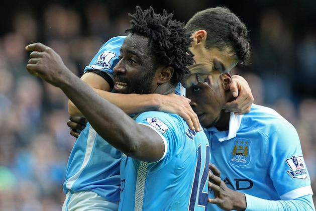 Manchester City's Ivorian striker Wilfried Bony (L) celebrates with teammates after scoring their fifth goal of the English Premier League football match between Manchester City and Bournemouth at the Etihad Stadium in Manchester, northwest England, on October 17, 2015. Manchester City won the game 5-1. AFP PHOTO / LINDSEY PARNABY
RESTRICTED TO EDITORIAL USE. No use with unauthorized audio, video, data, fixture lists, club/league logos or 'live' services. Online in-match use limited to 75 images, no video emulation. No use in betting, games or single club/league/player publications. (Photo credit should read LINDSEY PARNABY/AFP/Getty Images) Manchester City's Ivorian striker Wilfried Bony (L) celebrates with teammates after scoring their fifth goal of the English Premier League football match between Manchester City and Bournemouth at the Etihad Stadium in Manchester, northwest England, on October 17, 2015. Manchester City won the game 5-1. AFP PHOTO / LINDSEY PARNABY
RESTRICTED TO EDITORIAL USE. No use with unauthorized audio, video, data, fixture lists, club/league logos or 'live' services. Online in-match use limited to 75 images, no video emulation. No use in betting, games or single club/league/player publications. (Photo credit should read LINDSEY PARNABY/AFP/Getty Images)