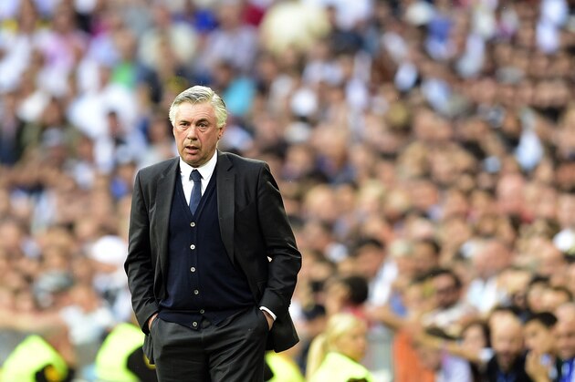 Real Madrid's Italian coach Carlo Ancelotti attends the Spanish league football match Real Madrid CF vs Valencia CF at the Santiago Bernabeu stadium in Madrid on May 9, 2015.   AFP PHOTO/ GERARD JULIEN        (Photo credit should read GERARD JULIEN/AFP/Getty Images)