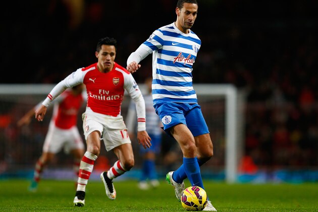 LONDON, ENGLAND - DECEMBER 26:  Rio Ferdinand of QPR is chased by Alexis Sanchez of Arsenal during the Barclays Premier League match between Arsenal and Queens Park Rangers at Emirates Stadium on December 26, 2014 in London, England.  (Photo by Julian Finney/Getty Images)