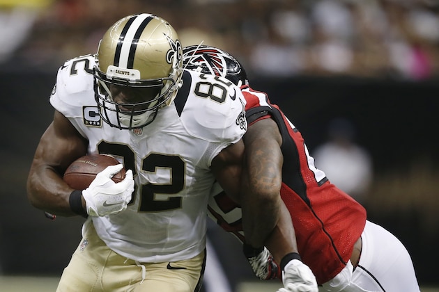 New Orleans Saints tight end Benjamin Watson (82) runs as Atlanta Falcons strong safety William Moore (25) holds on during the second half of an NFL football game, Thursday, Oct. 15, 2015, in New Orleans. (AP Photo/Gerald Herbert)