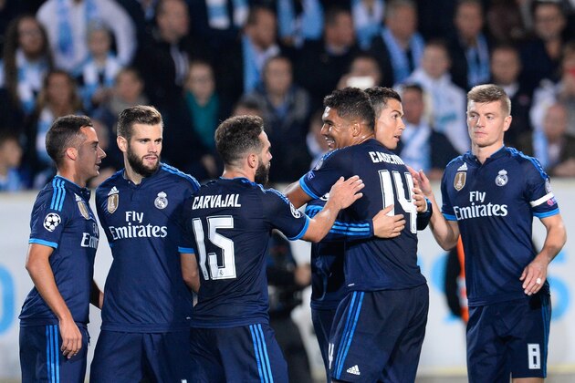 Real Madrid's Portuguese forward Cristiano Ronaldo (3rd R) celebrates with his teammates after scoring during the UEFA Champions League first-leg Group A football match between Malmo FF and Real Madrid CF at the Swedbank Stadion, in Malmo, Sweden on September 30, 2015. 
AFP PHOTO / JONATHAN NACKSTRAND        (Photo credit should read JONATHAN NACKSTRAND/AFP/Getty Images)