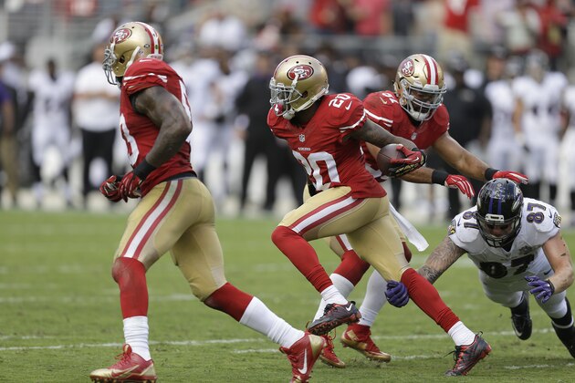 San Francisco 49ers cornerback Kenneth Acker (20) runs with an interception in front of Baltimore Ravens tight end Maxx Williams (87) during the second half of an NFL football game in Santa Clara, Calif., Sunday, Oct. 18, 2015. (AP Photo/Ben Margot)
