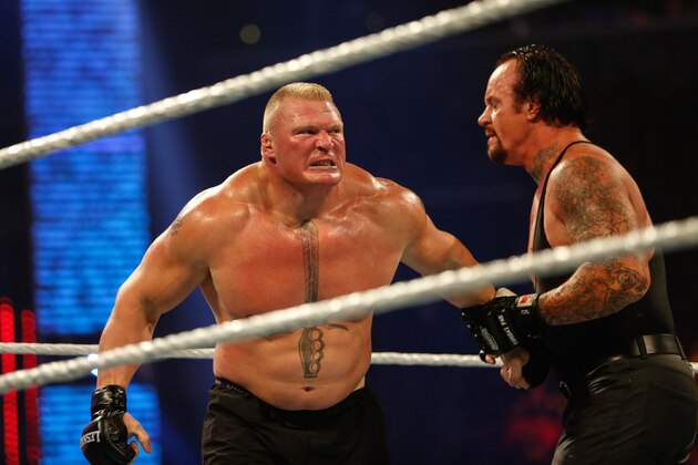 NEW YORK, NY - AUGUST 23:  Brock Lesnar and The Undertaker battle it out at the WWE SummerSlam 2015 at Barclays Center of Brooklyn on August 23, 2015 in New York City.  (Photo by JP Yim/Getty Images)