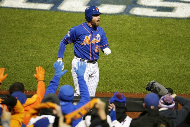 New York Mets' Daniel Murphy celebrates after hitting a two-run home run during the first inning of Game 2 of the National League baseball championship series against the Chicago Cubs Sunday, Oct. 18, 2015, in New York. (AP Photo/Frank Franklin II)