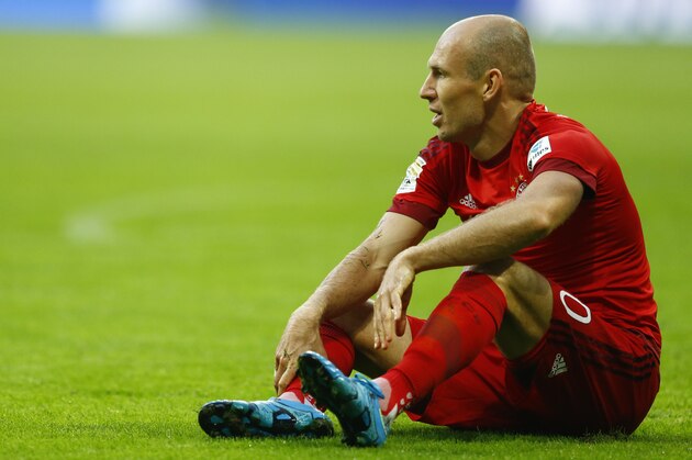 Bayern's Arjen Robben sits on the ground during the German Bundesliga soccer match between FC Bayern Munich and Bayer Leverkusen 04 in Munich, Germany, Saturday, Aug. 29, 2015. (AP Photo/Matthias Schrader)