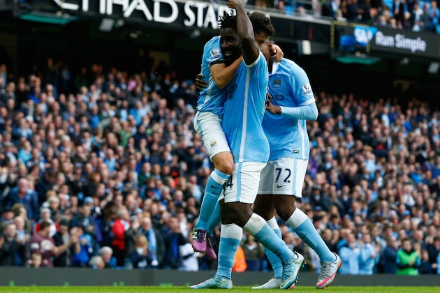MANCHESTER, ENGLAND - OCTOBER 17:  Wilfred Bony (C) of Manchester City celebrates scoring his team's fifth goal with his team mate Jesus Navas (L) and Kelechi Iheanacho (R) during the Barclays Premier League match between Manchester City and A.F.C. Bournemouth at Etihad Stadium on October 17, 2015 in Manchester, England.  (Photo by Dean Mouhtaropoulos/Getty Images)