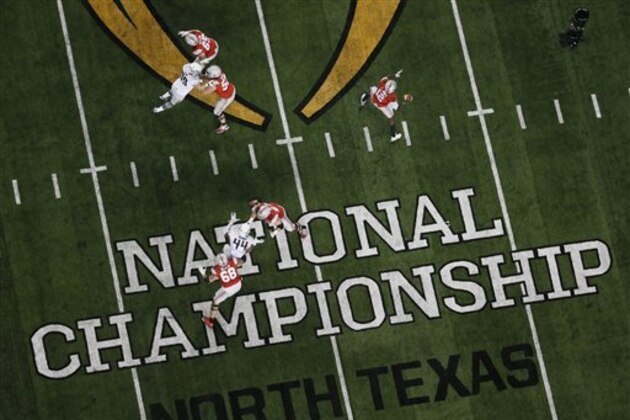 Ohio State and Oregon compete during the second half of the NCAA college football playoff championship game Monday, Jan. 12, 2015, in Arlington, Texas. (AP Photo/Tony Gutierrez)