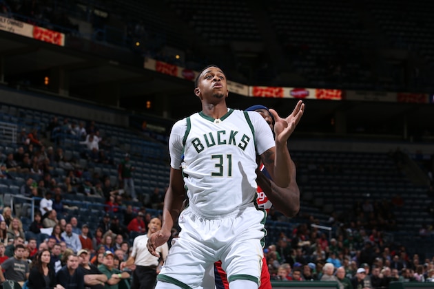 Milwaukee, WI - OCTOBER 17:  John Henson #31 of the Milwaukee Bucks boxes out against the Washington Wizards during a preseason game on October 17, 2015 at the BMO Harris Bradley Center in Milwaukee, Wisconsin. NOTE TO USER: User expressly acknowledges and agrees that, by downloading and or using this Photograph, user is consenting to the terms and conditions of the Getty Images License Agreement. Mandatory Copyright Notice: Copyright 2015 NBAE (Photo by Gary Dineen/NBAE via Getty Images)