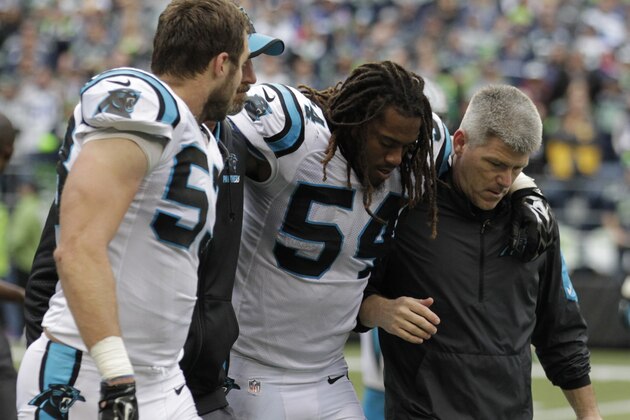 Carolina Panthers outside linebacker Shaq Thompson (54) is helped from the field after going down with an injury in the second half of an NFL football game against the Seattle Seahawks, Sunday, Oct. 18, 2015, in Seattle. The Panthers beat the Seahawks 27-23. (AP Photo/Stephen Brashear)