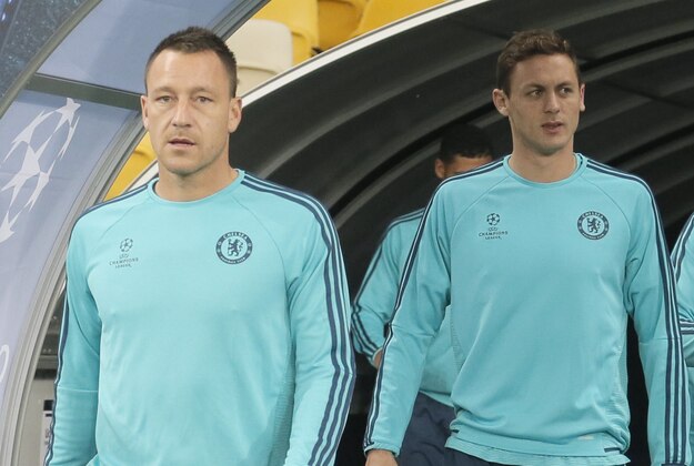 Chelsea's John Terry, left, and teammates take to the pitch prior to a team training session at at Olimpiyskiy Stadium in Kiev, Ukraine, Monday, Oct.. 19, 2015. Chelsea  and Dynamo Kiev will play on Tuesday in Group G Champions League soccer match in Kiev. (AP Photo/Efrem Lukatsky)