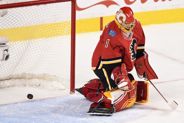 Oct 17, 2015; Calgary, Alberta, CAN; Calgary Flames goalie Jonas Hiller (1) is scored on by Edmonton Oilers center Connor McDavid (not pictured) during the second period at Scotiabank Saddledome. Mandatory Credit: Candice Ward-USA TODAY Sports