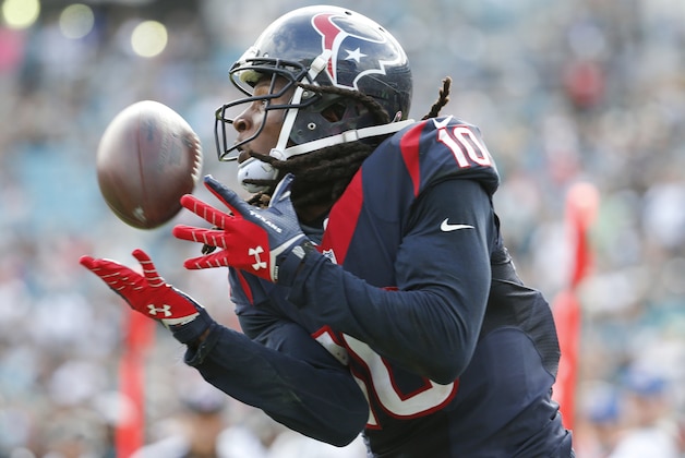 Houston Texans wide receiver DeAndre Hopkins (10) makes a catch for a 26-yard touchdown against the Jacksonville Jaguars during the second half of an NFL football game in Jacksonville, Fla., Sunday, Oct. 18, 2015. (AP Photo/Stephen B. Morton)