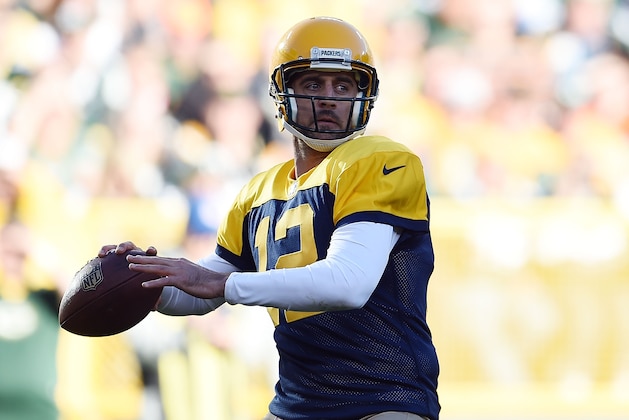 GREEN BAY, WI - OCTOBER 18:  Aaron Rodgers #12 of the Green Bay Packers drops back to pass during a game against the San Diego Chargers at Lambeau Field on October 18, 2015 in Green Bay, Wisconsin.  Green Bay defeated San Diego 27-20.  (Photo by Stacy Revere/Getty Images)