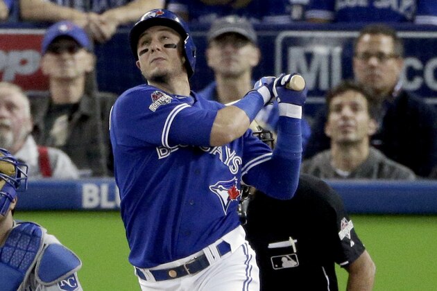 Toronto Blue Jays' Troy Tulowitzki watches his three run home run against the Kansas City Royals watches during the third inning in Game 3 of baseball's American League Championship Series on Monday, Oct. 19, 2015, in Toronto. (AP Photo/Charlie Riedel)
