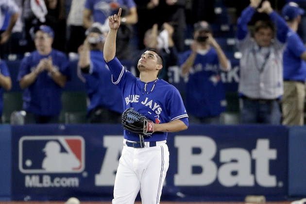 Toronto Blue Jays relief pitcher Roberto Osuna celebrates their 11-8 win against the Kansas City Royals in Game 3 of baseball's American League Championship Series on Monday, Oct. 19, 2015, in Toronto. (AP Photo/Charlie Riedel)