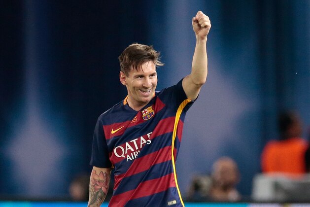 Barcelona's Lionel Messi celebrates after scoring his side’s second goal during the UEFA Super Cup soccer match between FC Barcelona and Sevilla FC at the Boris Paichadze Dinamo Arena stadium, in Tbilisi, Georgia, on Wednesday, Aug. 12, 2015. (AP Photo/Ivan Sekretarev)