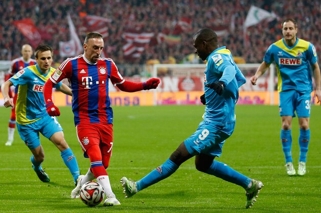 MUNICH, GERMANY - FEBRUARY 27:  Franck Ribery (C) of Muenchen is challenged by Anthony Ujah (2.R) of Koeln during the Bundesliga match between FC Bayern Muenchen and 1. FC Koeln at Allianz Arena on February 27, 2015 in Munich, Germany.  (Photo by Boris Streubel/Getty Images)