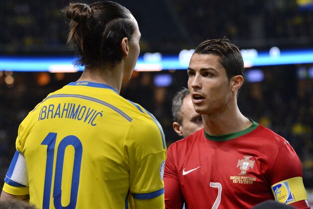 Sweden's forward Zlatan Ibrahimovic (L) shakes hands with Portugal's forward Cristiano Ronaldo prior to the FIFA 2014 World Cup playoff football match Sweden vs Portugal at the Friends Arena in Solna, near Stockholm on November 19, 2013. Portugal won the match 2-3 to secure their place at the World Cup in Brazil. AFP PHOTO/JONATHAN NACKSTRAND        (Photo credit should read JONATHAN NACKSTRAND/AFP/Getty Images)