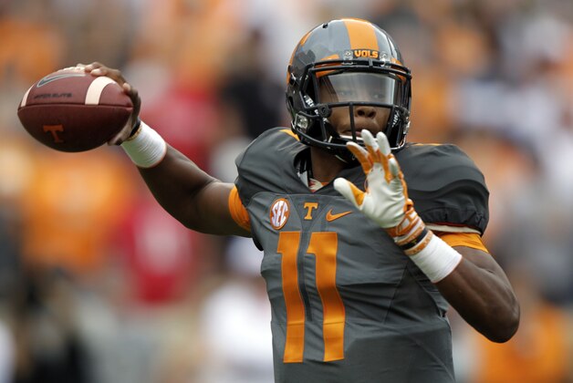 Tennessee quarterback Joshua Dobbs (11) throws to a receiver during the first half of an NCAA college football game against Georgia Saturday, Oct. 10, 2015, in Knoxville, Tenn. (AP Photo/Wade Payne)