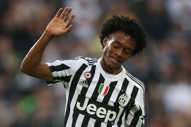 Juventus' midfielder Juan Cuadrado from Colombia reacts during the Italian Serie A  football match Juventus Vs Bologna on October 4, 2015 at the 'Juventus Stadium' in Turin.  AFP PHOTO / MARCO BERTORELLO        (Photo credit should read MARCO BERTORELLO/AFP/Getty Images)