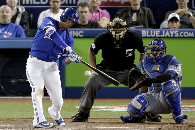Toronto Blue Jays' Ryan Goins hits a home run against the Kansas City Royals during the fifth inning in Game 3 of baseball's American League Championship Series on Monday, Oct. 19, 2015, in Toronto. (AP Photo/Charlie Riedel)