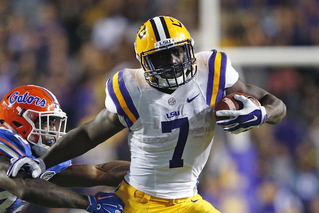 LSU running back Leonard Fournette (7) carries against Florida defensive back Keanu Neal (42) in the second half of an NCAA college football game in Baton Rouge, La., Saturday, Oct. 17, 2015. LSU won 35-28. (AP Photo/Gerald Herbert)