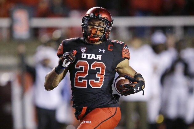 Utah running back Devontae Booker (23) carries the ball for a score against Arizona State during the second half during an NCAA college football game Saturday, Oct. 17, 2015, in Salt Lake City. Utah won 34-18. (AP Photo/Rick Bowmer)