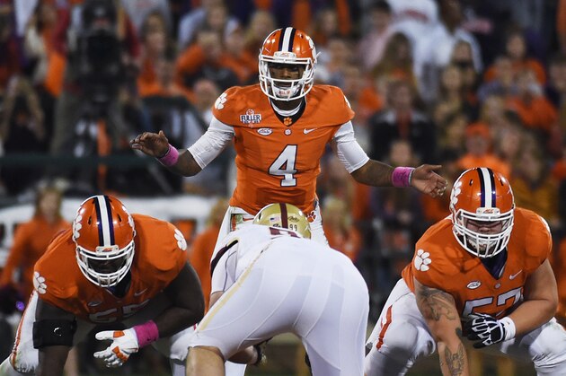 Clemson quarterback Deshaun Watson (4) gestures at the line of scrimmage before a play against Boston College during the second half of an NCAA college football game, Saturday, Oct. 17, 2015, in Clemson, S.C. (AP Photo/Rainier Ehrhardt)
