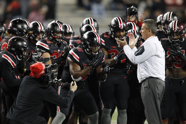 Ohio State coach Urban Meyer leads members of his team in a cheer before the start of an NCAA college football game again Penn State Saturday, Oct. 17, 2015, in Columbus, Ohio. Ohio State beat Penn State 38-10. (AP Photo/Paul Vernon)