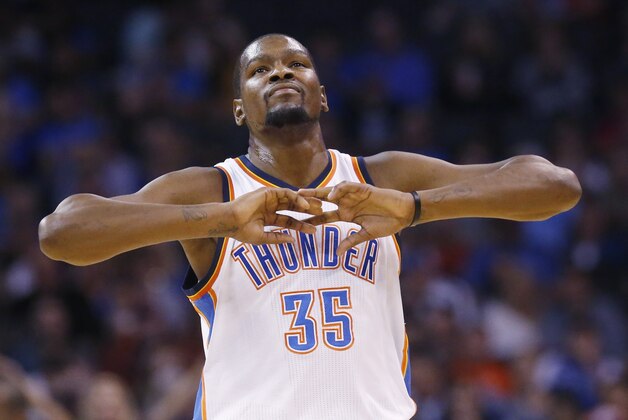 Oklahoma City Thunder forward Kevin Durant (35) gestures in the first quarter of a preseason NBA basketball game against the Denver Nuggets in Oklahoma City, Sunday, Oct. 18, 2015. (AP Photo/Sue Ogrocki)