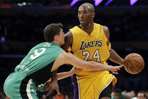 Maccabi Haifa’s Yiftach Ziv, left, defends Los Angeles Lakers' Kobe Bryant during the second half of an NBA preseason basketball game, Sunday, Oct. 11, 2015, in Los Angeles. The Lakers won 126-83. (AP Photo/Jae C. Hong)