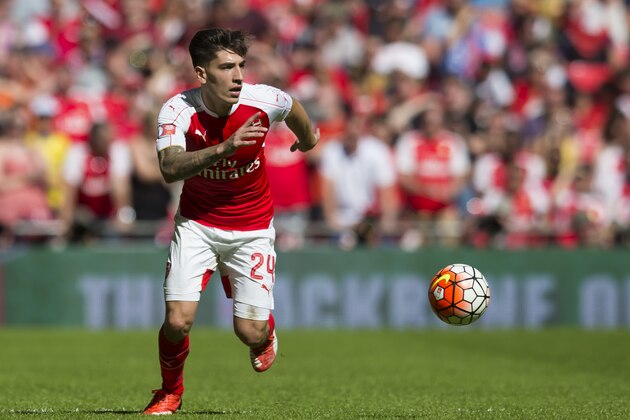 Arsenal's Hector Bellerin takes the ball downfield during his team's English Community Shield soccer match between Arsenal and Chelsea at Wembley Stadium, London, England, Sunday Aug. 2, 2015. (AP Photo/Jon Super)