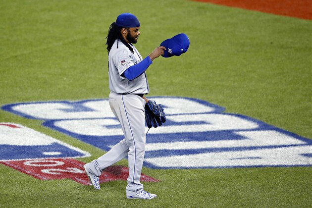 Kansas City Royals starting pitcher Johnny Cueto leaves the game against the Toronto Blue Jays during the third inning in Game 3 of baseball's American League Championship Series on Monday, Oct. 19, 2015, in Toronto. (AP Photo/Paul Sancya)