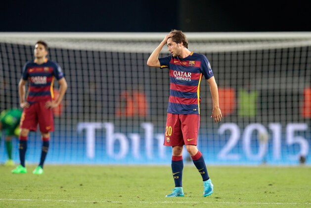 Barcelona´s Sergi Roberto reacts after Sevilla scored their fourth goal during the UEFA Super Cup soccer match between FC Barcelona and Sevilla FC at the Boris Paichadze Dinamo Arena stadium, in Tbilisi, Georgia, on Wednesday, Aug. 12, 2015. (AP Photo/Ivan Sekretarev)
