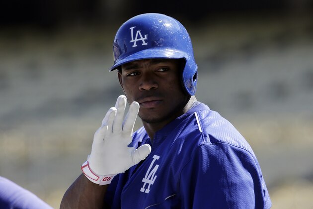 Los Angeles Dodgers right fielder Yasiel Puig waves during batting practice for the National League Division Series between the Los Angeles Dodgers and the New York Mets that is set to begin on Friday, Thursday, Oct. 8, 2015 in Los Angeles. (AP Photo/Chris Carlson)